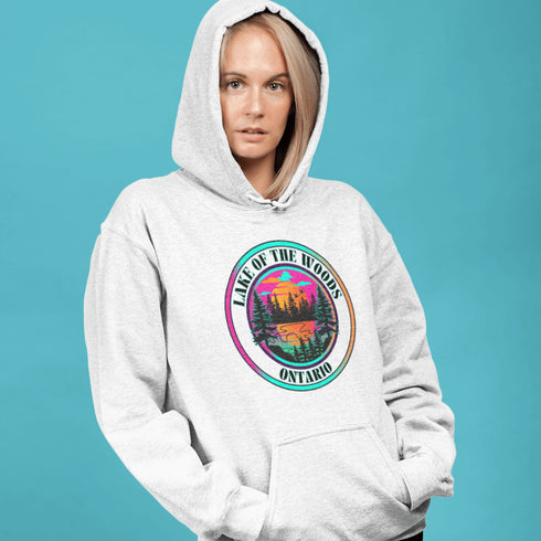Featuring a stunning lake scene with a vibrant sunset, this hoodie captures the beauty of Lake of the Woods in Ontario, where tranquil waters meet the warm glow of a setting sun.
